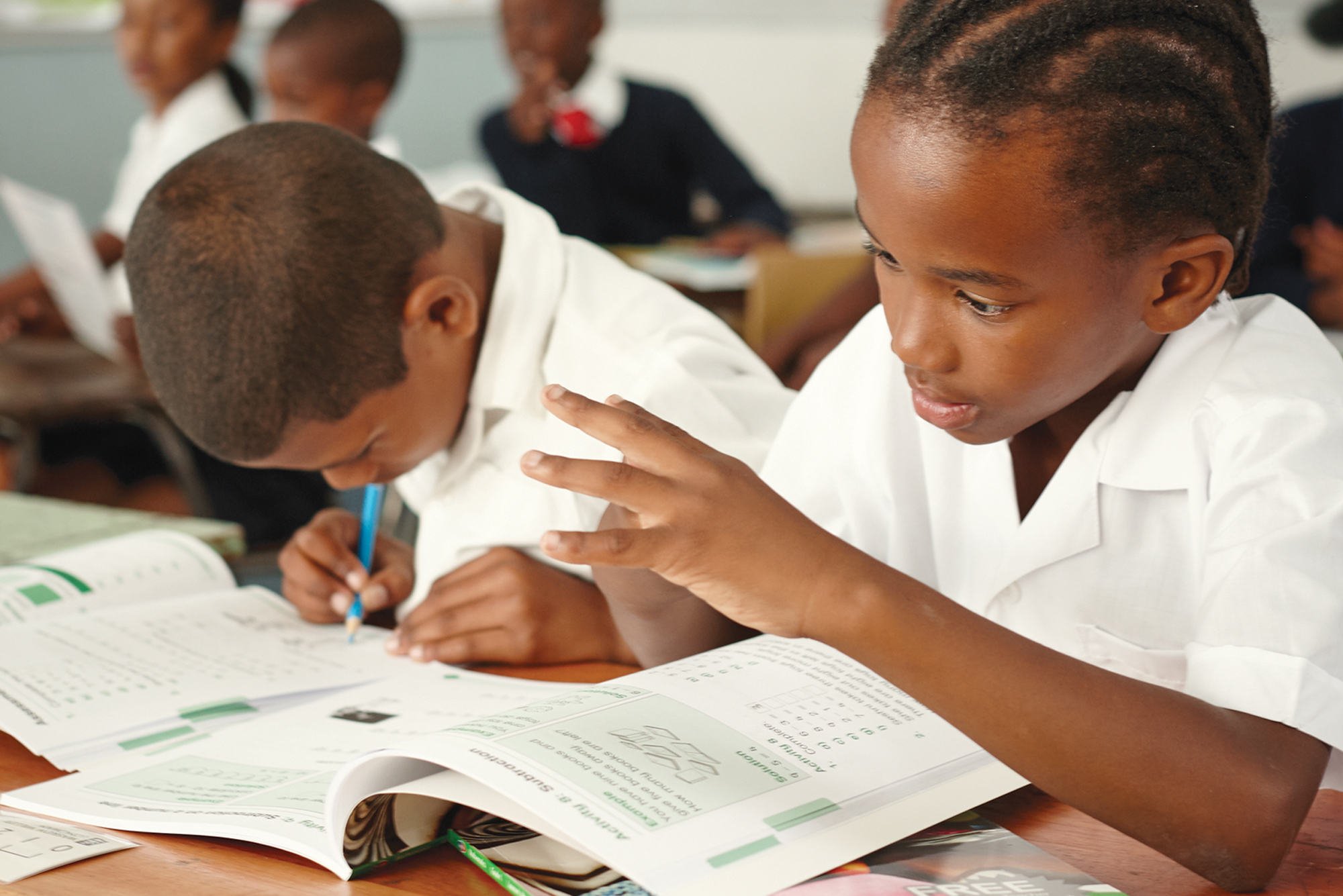 Young learner doing math in class